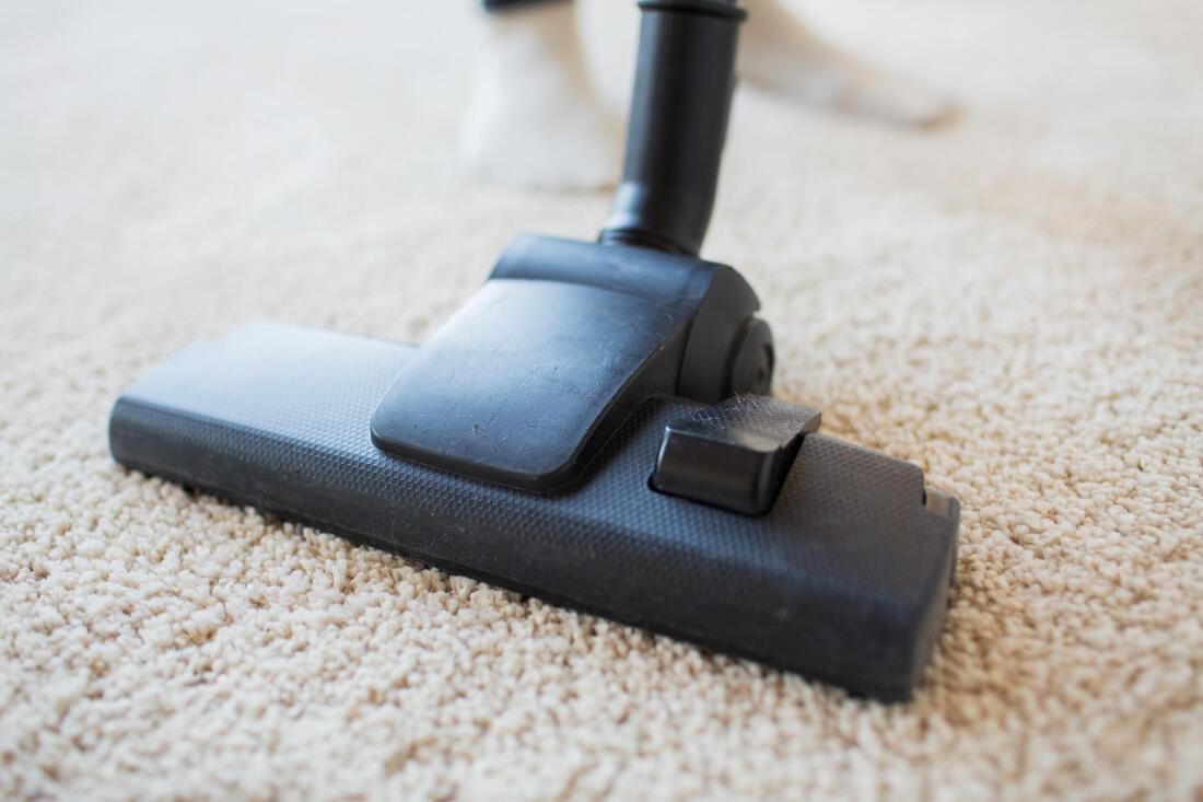 vacuuming the dirty mat